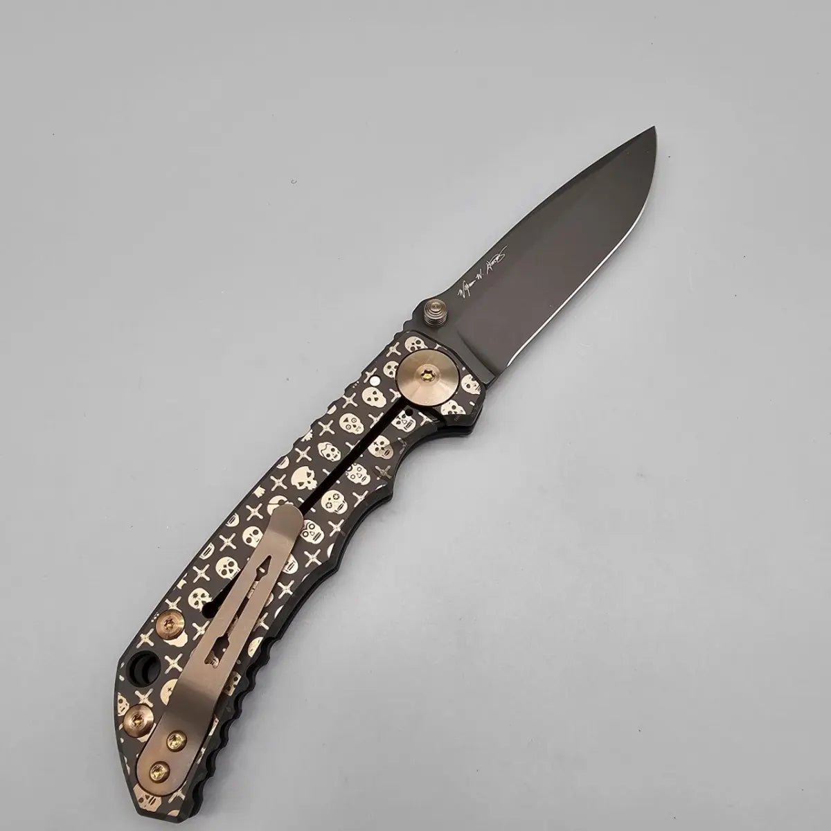 SPARTAN BLADES SF5GILDEDSKULLS SHF TI HANDLE  SE CPM-MAGNACUT SPARTAN HARSEY GILDED SKULLS FOLDING KNIFE.
